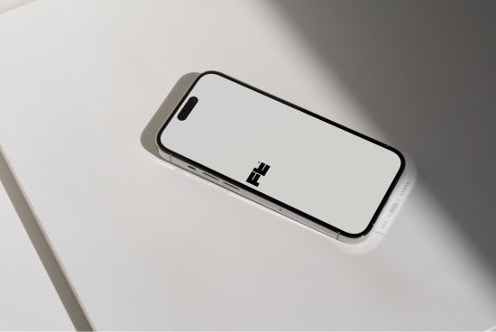 Smartphone mockup on a white surface with elegant shadows, ideal for screen interface design presentations.